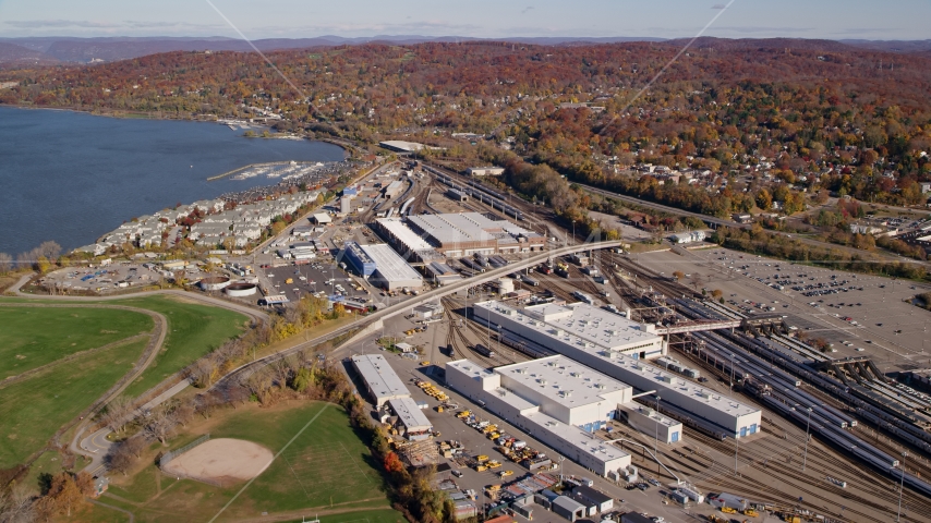 Riverfront rail station in Autumn, Croton on Hudson, New York Aerial Stock Photos AX119_129.0000094F