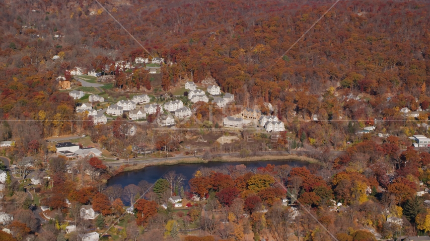 Condominium complexes overlooking Garrison Pond in Autumn, Fort Montgomery, New York Aerial Stock Photos AX119_157.0000152F