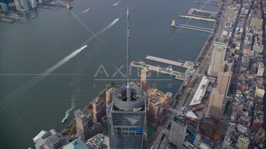 One World Trade Center spire and the Hudson River in Lower Manhattan, New York City Aerial Stock Photos AX120_109.0000324F