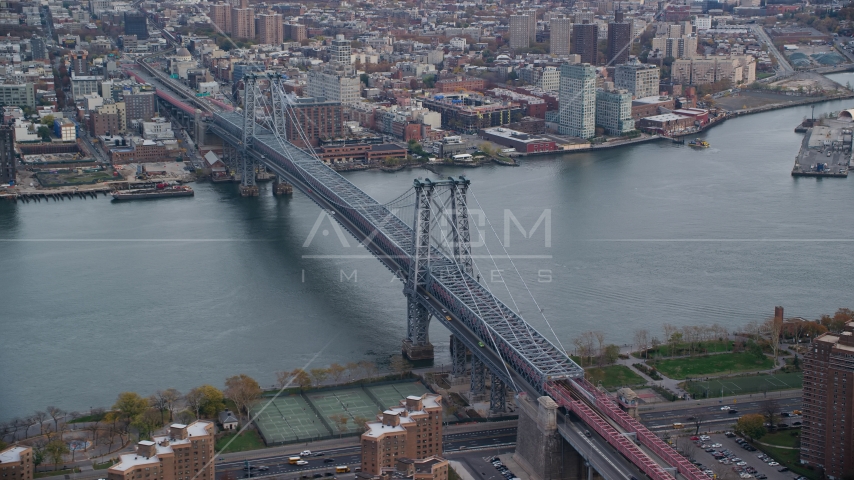 The Williamsburg Bridge spanning the East River in Autumn, New York City Aerial Stock Photos AX120_153.0000347F