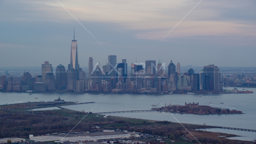 Lower Manhattan skyline and Ellis Island at sunset in Autumn, New York City Aerial Stock Photos AX121_011.0000090F