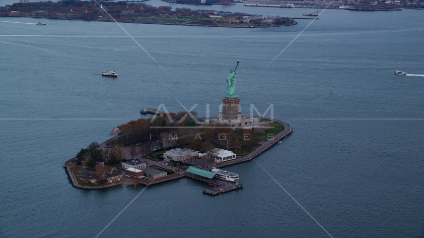 The Statue of Liberty at sunset In Autumn, New York Aerial Stock Photos AX121_013.0000082F