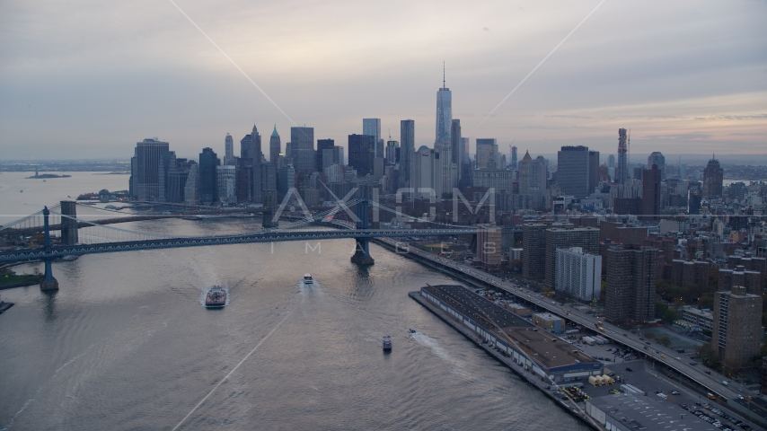 The Manhattan Bridge and the Lower Manhattan skyline at sunset in New York City Aerial Stock Photos AX121_027.0000009F