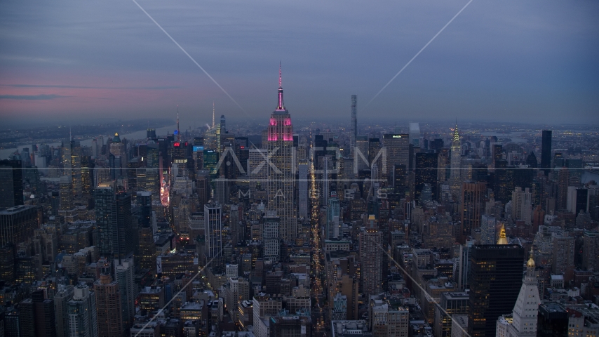 A view of the Empire State Building in Midtown at sunset in New York City Aerial Stock Photos AX121_082.0000155F