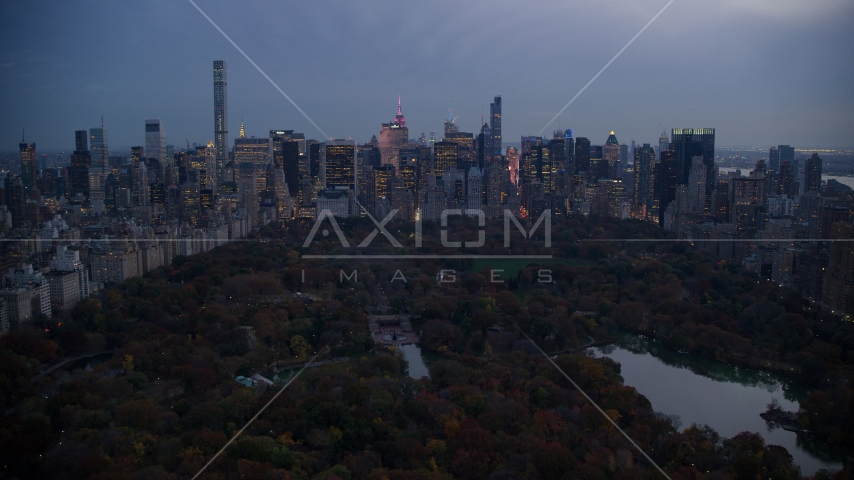 Midtown Manhattan skyscrapers and The Lake in Central Park at sunset, New York City Aerial Stock Photos AX121_098.0000265F