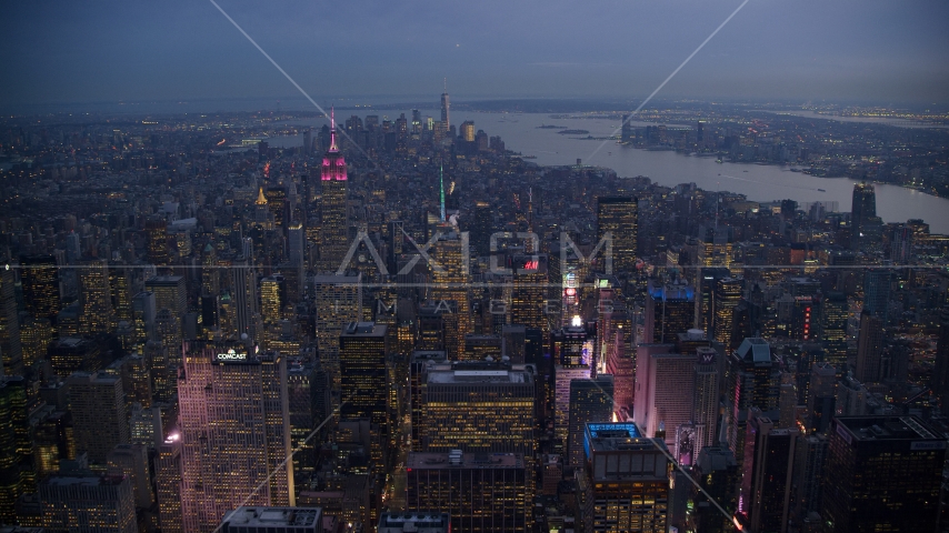 Times Square and Midtown skyscrapers with Lower Manhattan in the background at sunset, New York City Aerial Stock Photo AX121_103.0000219F | Axiom Images