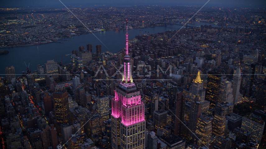 The top of Empire State Building at sunset in Midtown, New York City Aerial Stock Photos AX121_108.0000073F