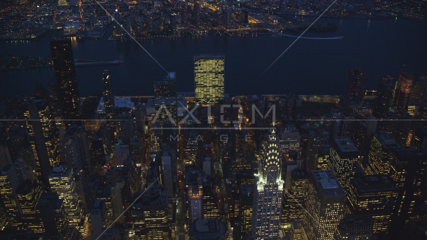The United Nations and top of the Chrysler Building at night in New York City Aerial Stock Photos AX121_138.0000000F | Axiom Images