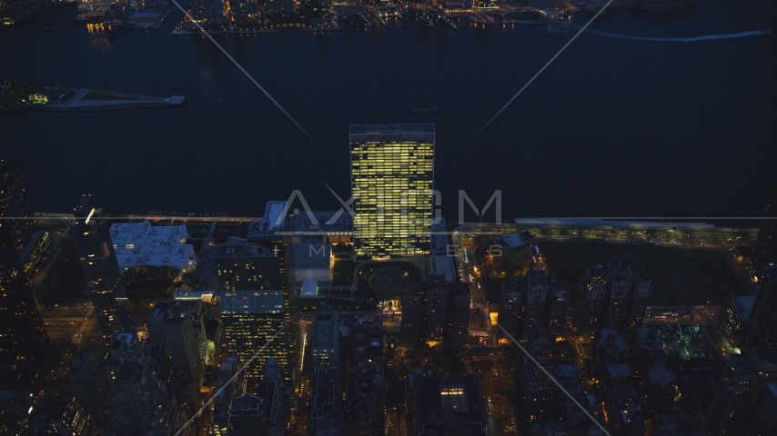 The United Nations by the East River at night in Midtown Manhattan, New York City Aerial Stock Photos AX121_138.0000309F