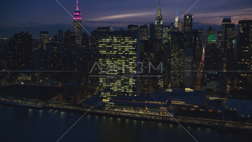 The United Nations building at night in New York City Aerial Stock Photos AX121_146.0000110F | Axiom Images