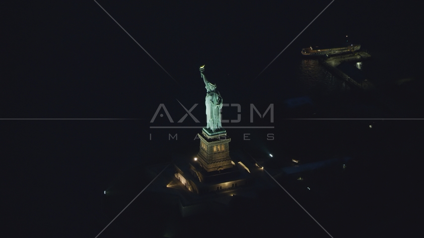 The Statue of Liberty at night in New York Aerial Stock Photos AX121_167.0000184F