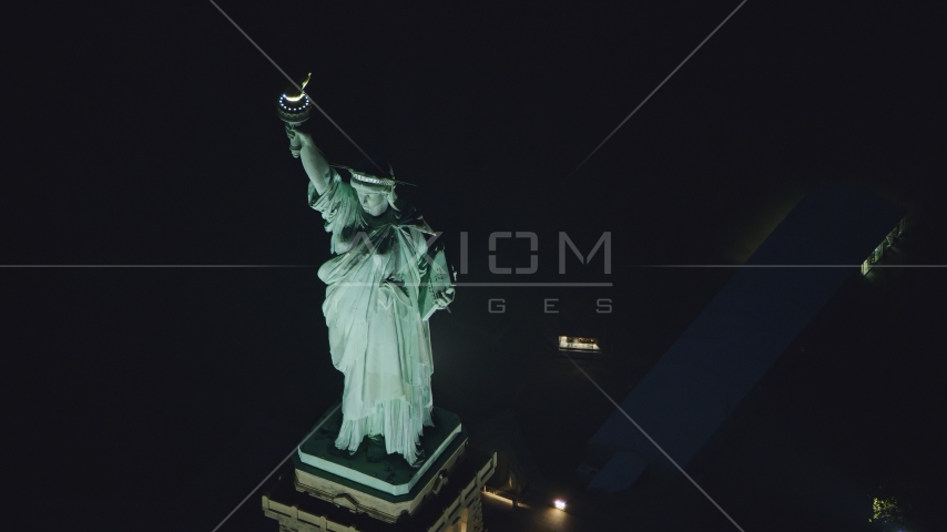 Statue of Liberty at nighttime in New York Aerial Stock Photos AX121_168.0000211F