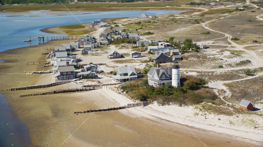 Beachfront houses at Sandy Neck Colony by Sandy Neck Light, Cape Cod, Barnstable, Massachusetts Aerial Stock Photo AX143_145.0000207 | Axiom Images