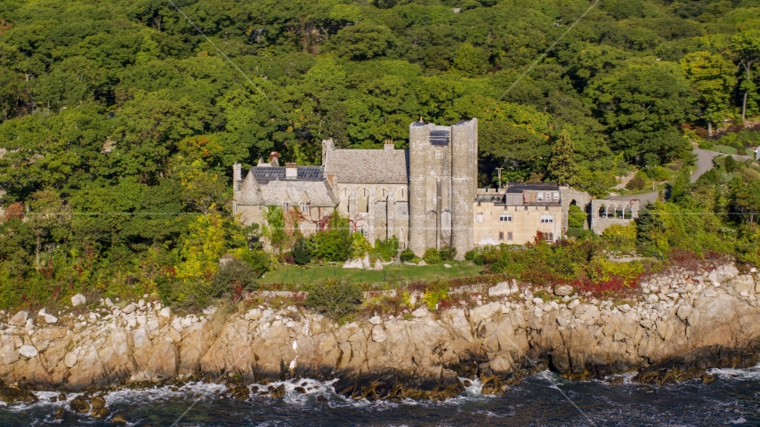 Hammond Castle on a rocky coastline, Gloucester, Massachusetts Aerial Stock Photo AX147_081.0000394 | Axiom Images