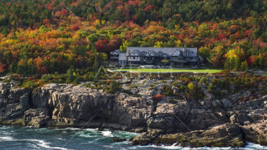 Isolated waterfront mansion and autumn trees, Seal Harbor, Mount Desert Island, Maine Aerial Stock Photo AX148_172.0000351 | Axiom Images