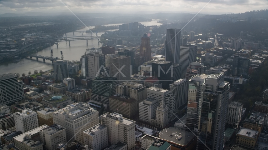 Skyscrapers beside bridges spanning the Willamette River in Downtown Portland, Oregon Aerial Stock Photos AX153_110.0000174F