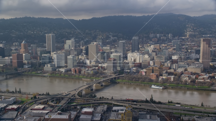 Downtown Portland skyscrapers across the Morrison Bridge and the Willamette River, Oregon Aerial Stock Photos AX153_121.0000355F