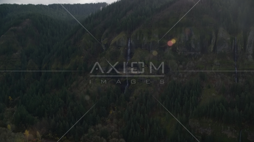 Waterfall on a Columbia River Gorge cliff face in Multnomah County, Oregon Aerial Stock Photos AX154_018.0000340F