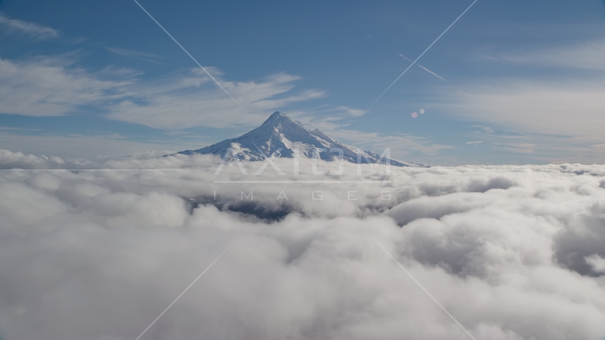 Snowy summit of Mount Hood above the clouds, Cascade Range, Oregon Aerial Stock Photos AX154_065.0000000F