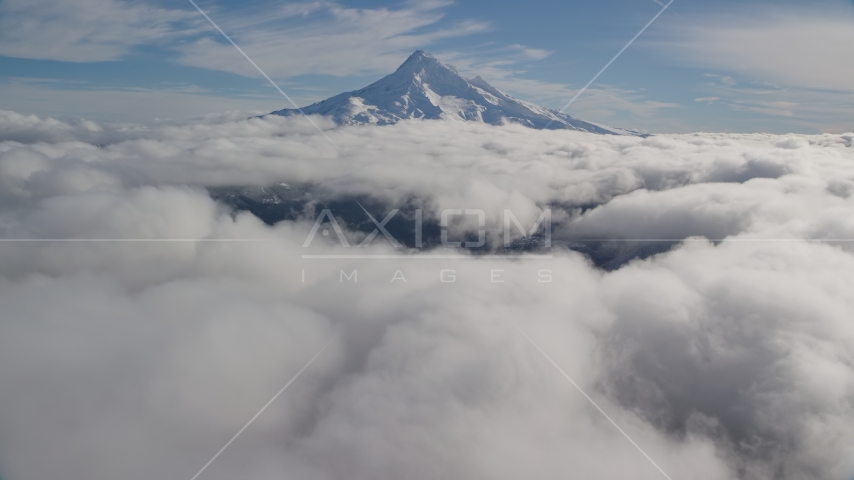 The snowy summit of Mount Hood and low clouds in the Cascade Range, Oregon Aerial Stock Photos AX154_066.0000182F