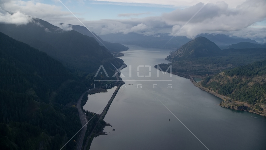 The I-84 highway at the base of mountains in Columbia River Gorge Aerial Stock Photos AX154_156.0000000F