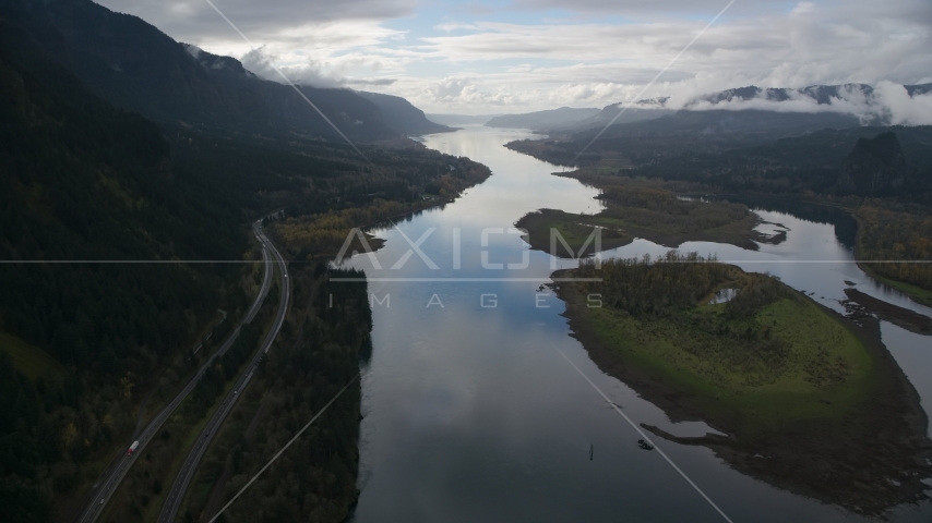 Columbia River and the I-84 highway by islands in the Columbia River Gorge Aerial Stock Photos AX154_180.0000321F