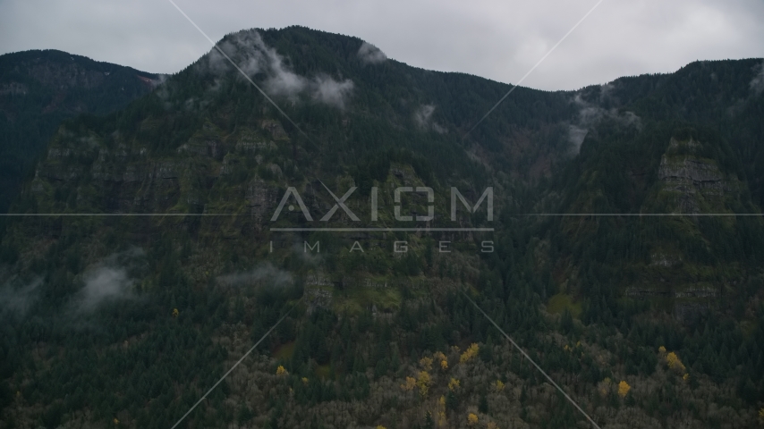Rugged mountain cliffs and misty clouds on the Oregon side of Columbia River Gorge Aerial Stock Photos AX154_185.0000238F