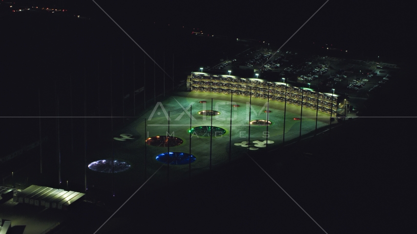 A warehouse building and a Topgolf course in Hillsboro, Oregon at night Aerial Stock Photo AX155_475.0000259F | Axiom Images