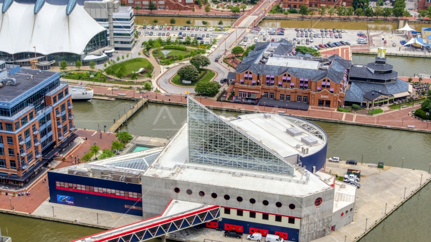 National Aquarium and Pier 5 Hotel Complex and lighthouse, Downtown Baltimore, Maryland Aerial Stock Photo AXP078_000_0011F | Axiom Images