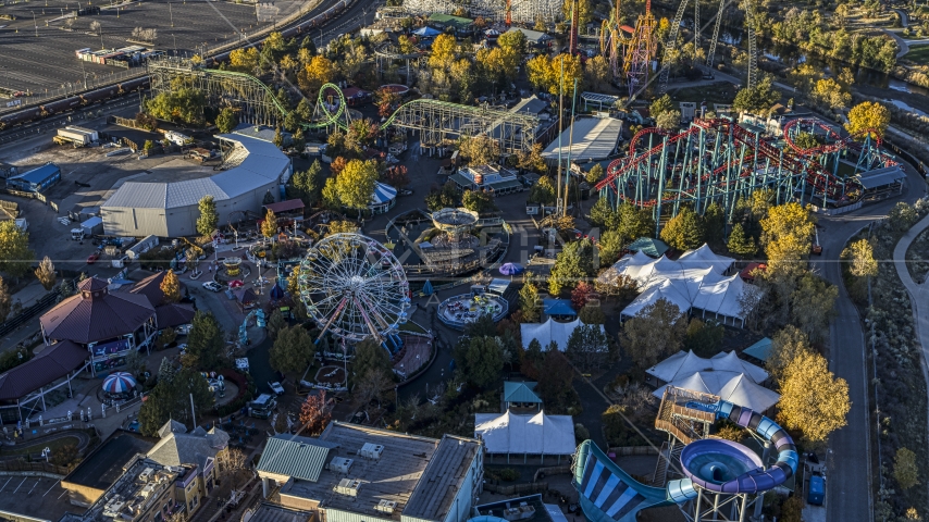 Theme park rides, Ferris wheel and roller coasters at Elitch Gardens at sunrise, Downtown Denver, Colorado Aerial Stock Photo DXP001_000118 | Axiom Images