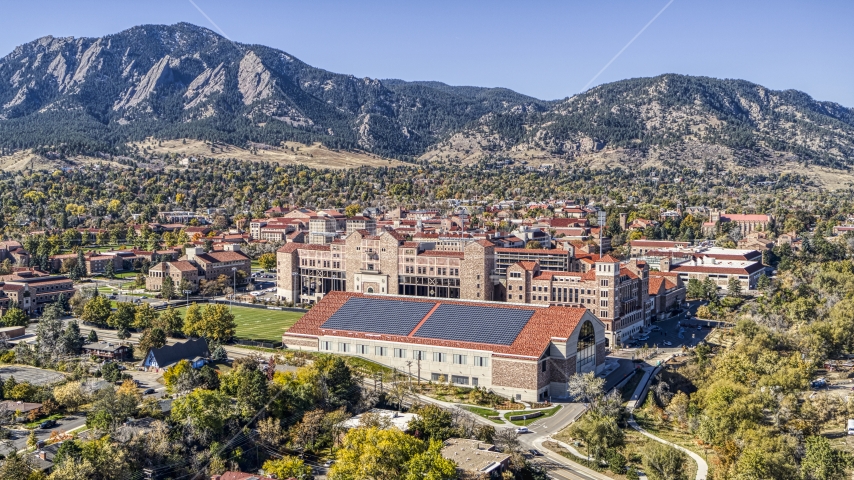 Buildings at the University of Colorado Boulder campus and mountains in the background, Boulder, Colorado Aerial Stock Photo DXP001_000204 | Axiom Images
