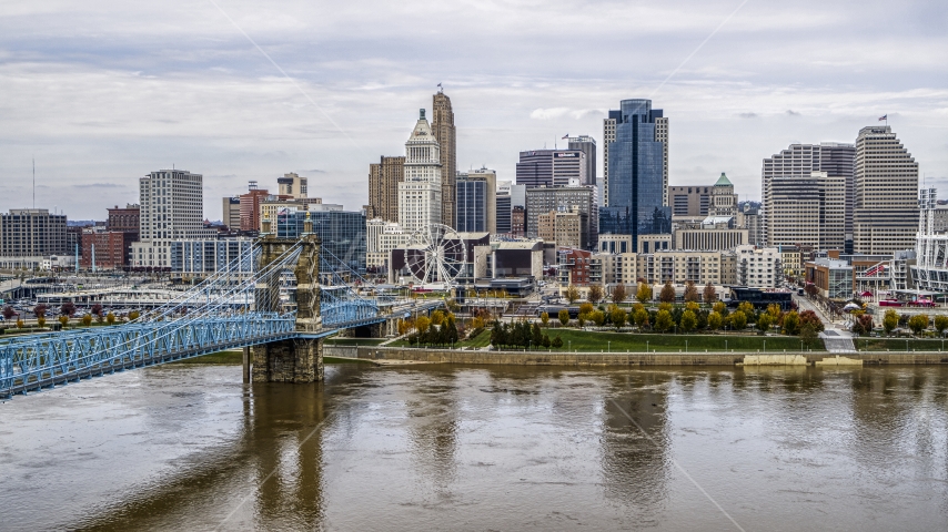The city's skyline and Roebling Bridge spanning the Ohio River, Downtown Cincinnati, Ohio Aerial Stock Photos DXP001_000452