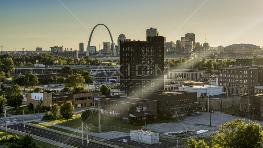 A brick building in East St. Louis, Illinois with the Gateway Arch in background Aerial Stock Photo DXP001_027_0003 | Axiom Images