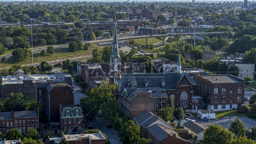 A church with a tall steeple in St. Louis, Missouri Aerial Stock Photo DXP001_033_0007 | Axiom Images