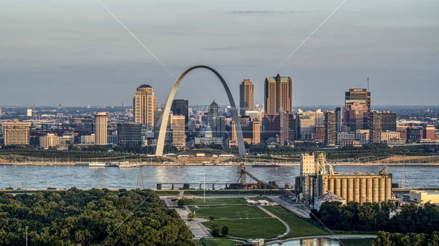 A view of the St. Louis Arch and the city skyline at sunrise in Downtown St. Louis, Missouri Aerial Stock Photo DXP001_038_0007 | Axiom Images
