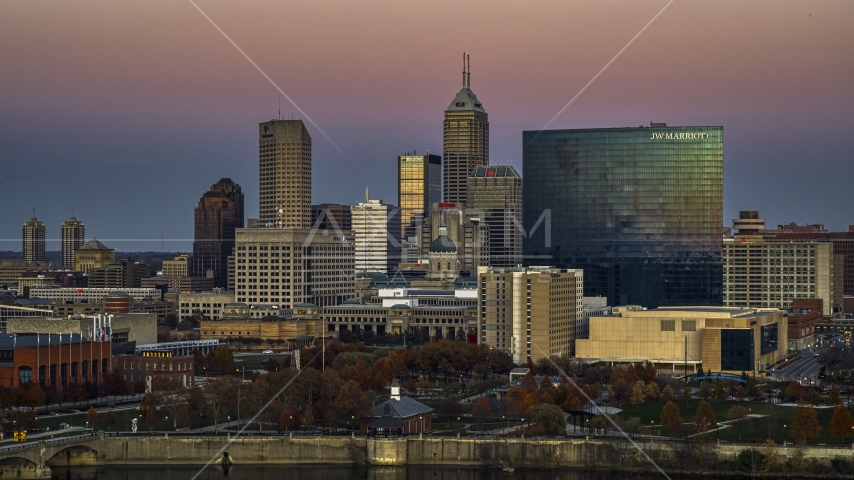 The city's towering skyline and a hotel at sunset in Downtown Indianapolis, Indiana Aerial Stock Photo DXP001_092_0021 | Axiom Images