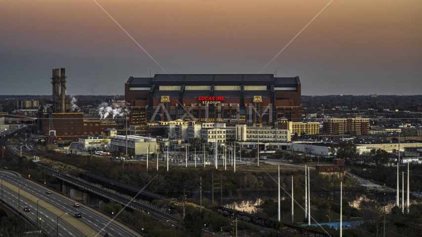 The side of a football stadium at sunset, Downtown Indianapolis, Indiana Aerial Stock Photo DXP001_092_0022 | Axiom Images