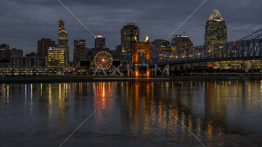 The city skyline across the Ohio River at twilight, Downtown Cincinnati, Ohio Aerial Stock Photos DXP001_098_0011