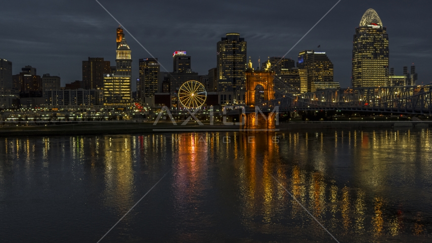 The city's skyline across the Ohio River at twilight, Downtown Cincinnati, Ohio Aerial Stock Photos DXP001_098_0015