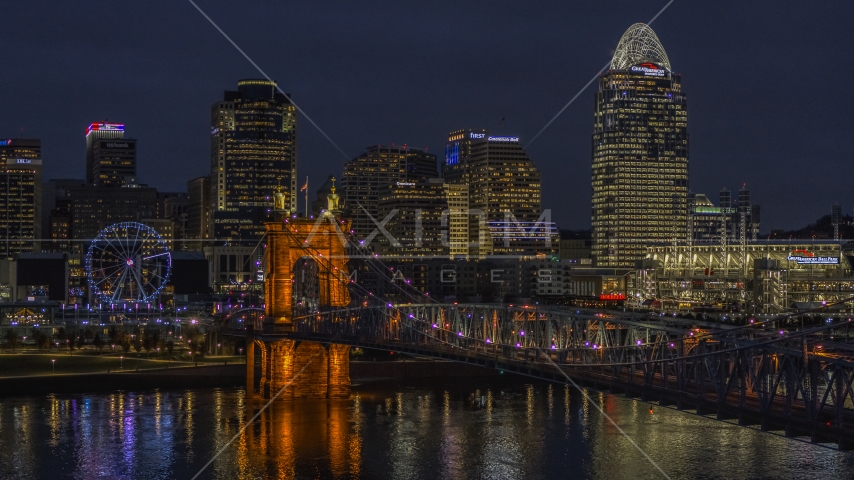 The Roebling Bridge at night and the city skyline, Downtown Cincinnati, Ohio Aerial Stock Photos DXP001_098_0017