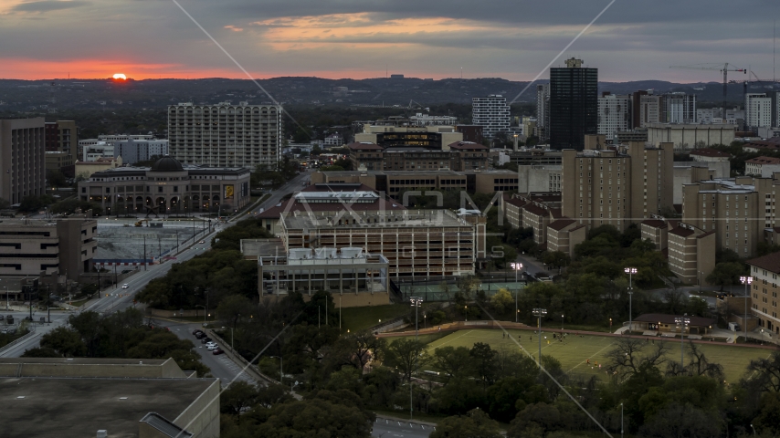 A view of the university campus with setting sun in distance, Austin, Texas Aerial Stock Photo DXP002_105_0015 | Axiom Images