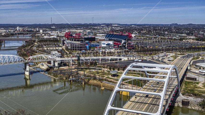 Nissan Stadium seen from a bridge in Nashville, Tennessee Aerial Stock Photo DXP002_116_0008 | Axiom Images
