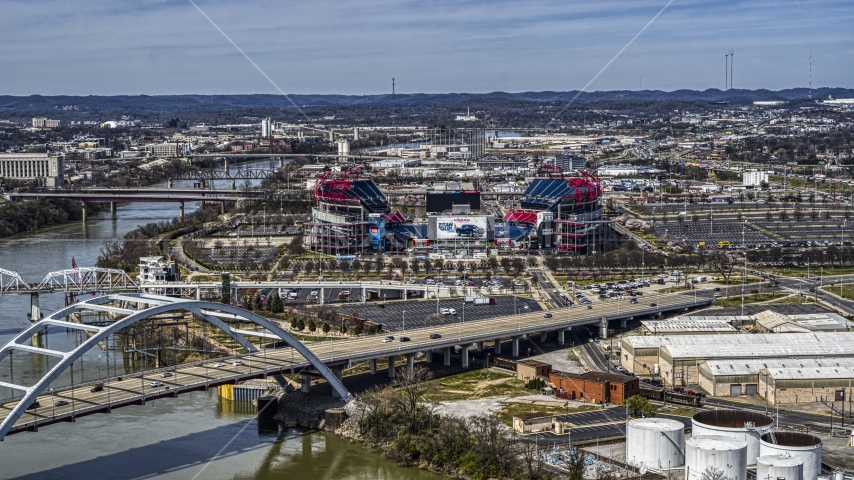 A view of Nissan Stadium from bridge in Nashville, Tennessee Aerial Stock Photo DXP002_116_0017 | Axiom Images
