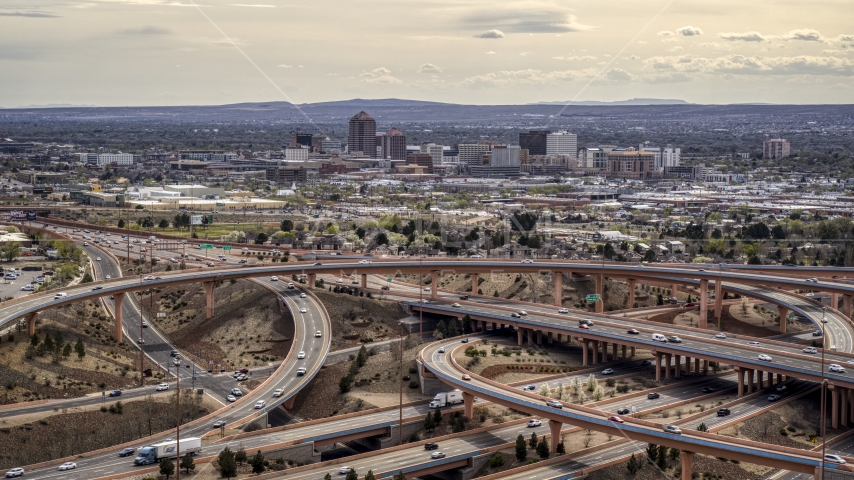 Downtown Albuquerque seen from freeway interchange traffic, New Mexico Aerial Stock Photos DXP002_126_0003