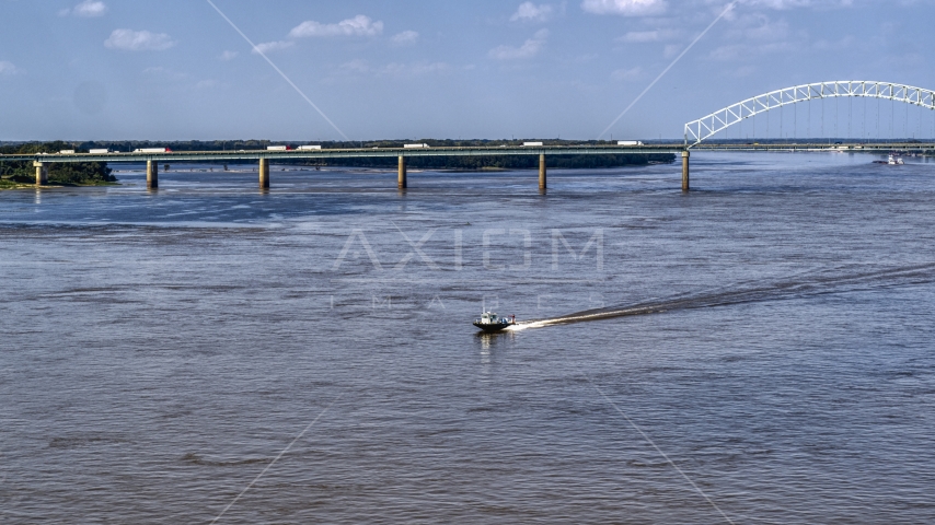 A boat racing across the Mississippi River, Memphis, Tennessee Aerial Stock Photo DXP002_183_0005 | Axiom Images
