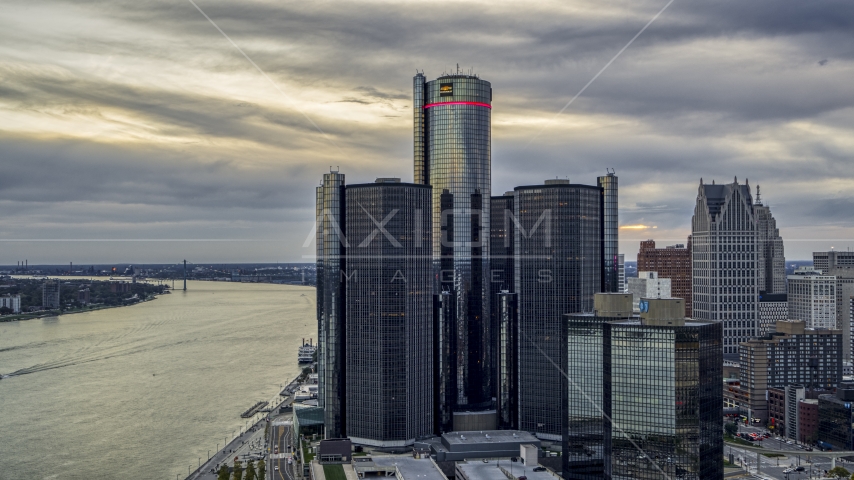 A towering riverfront skyscraper at sunset, Downtown Detroit, Michigan Aerial Stock Photo DXP002_192_0008 | Axiom Images