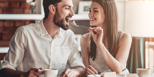 couple sharing dessert on a date