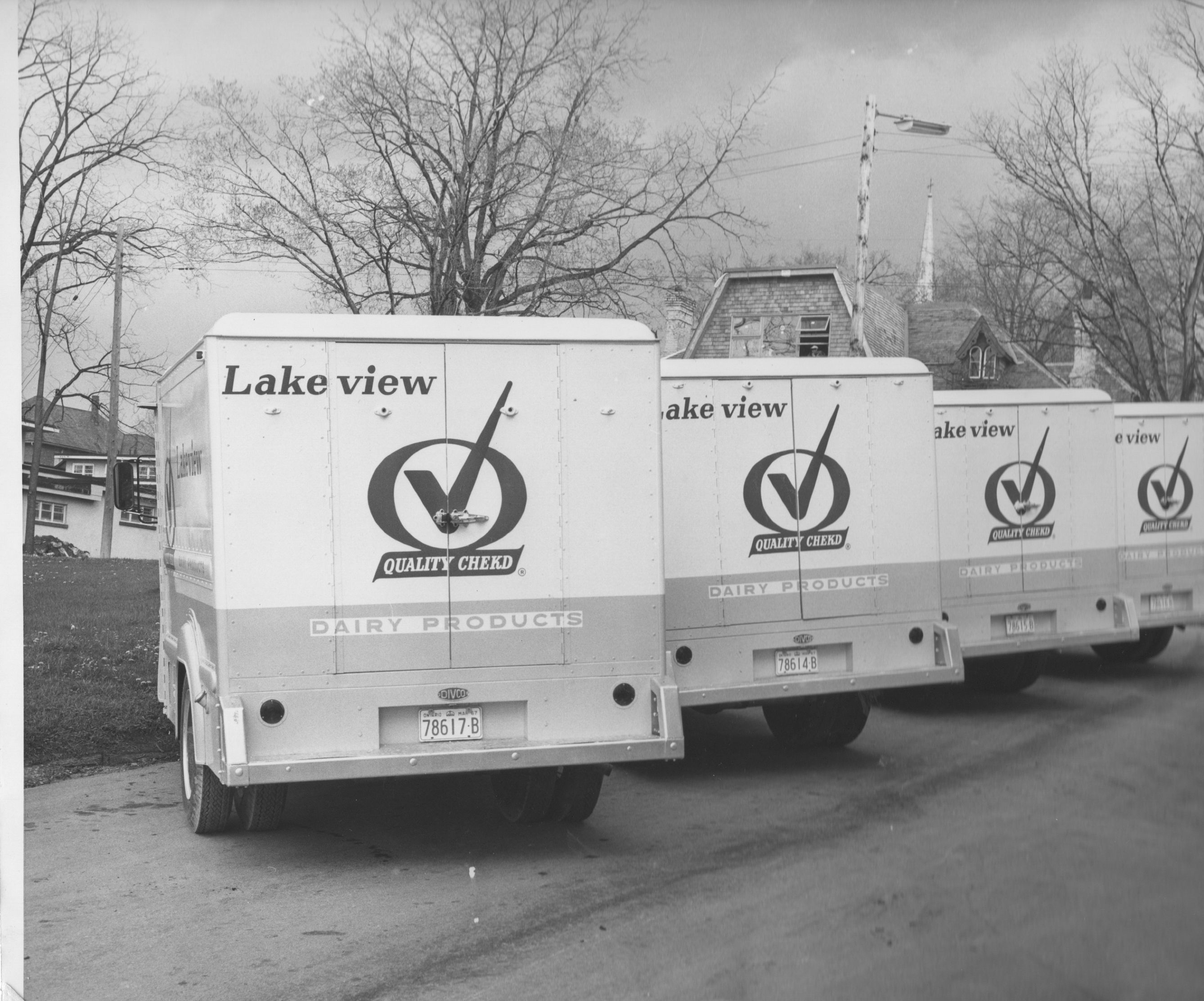 Lakeview Dairy delivery trucks lined up in the parking lot on Dunlop