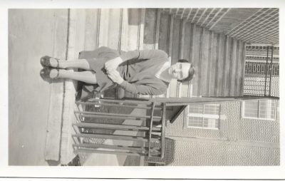 Ms. Riley, the latin teacher at Barrie Central Collegiate, sits outside the school on a staircase.