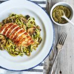 This savory Zucchini noodles recipe is topped with pesto, sautéed mushrooms, and chicken for an ultra-low in calorie, low-carb substitute for pasta.